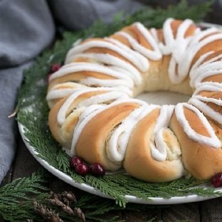 Cream Cheese Tea Roll on a white plate garnished for Christmas