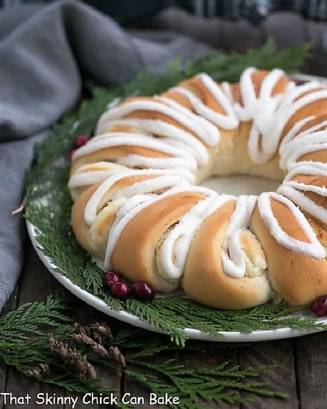 Cream Cheese Tea Roll on a white plate garnished for Christmas.