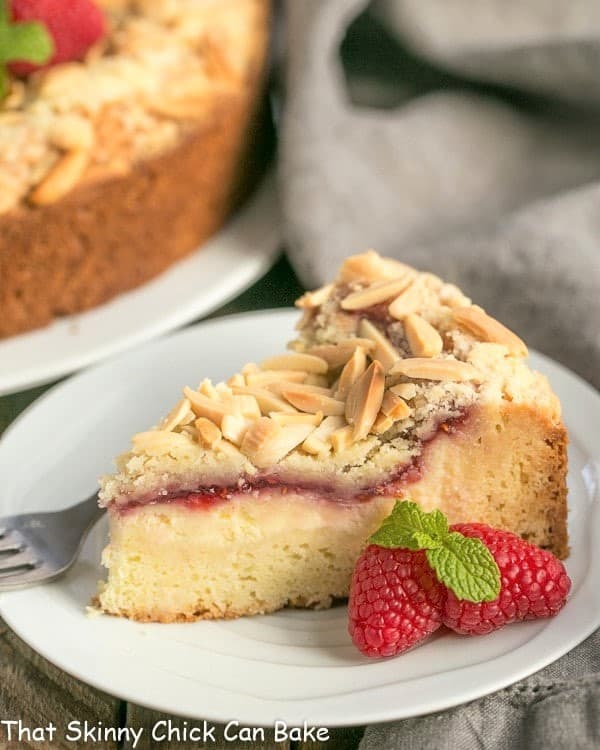 Raspberry Cream Cheese Coffee cake slice on a small white plate.