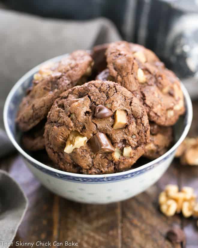 Chocolate Toffee Cookies in a white and blue bowl.