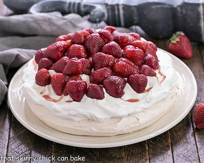 Strawberry Pavlova side view on a white platter