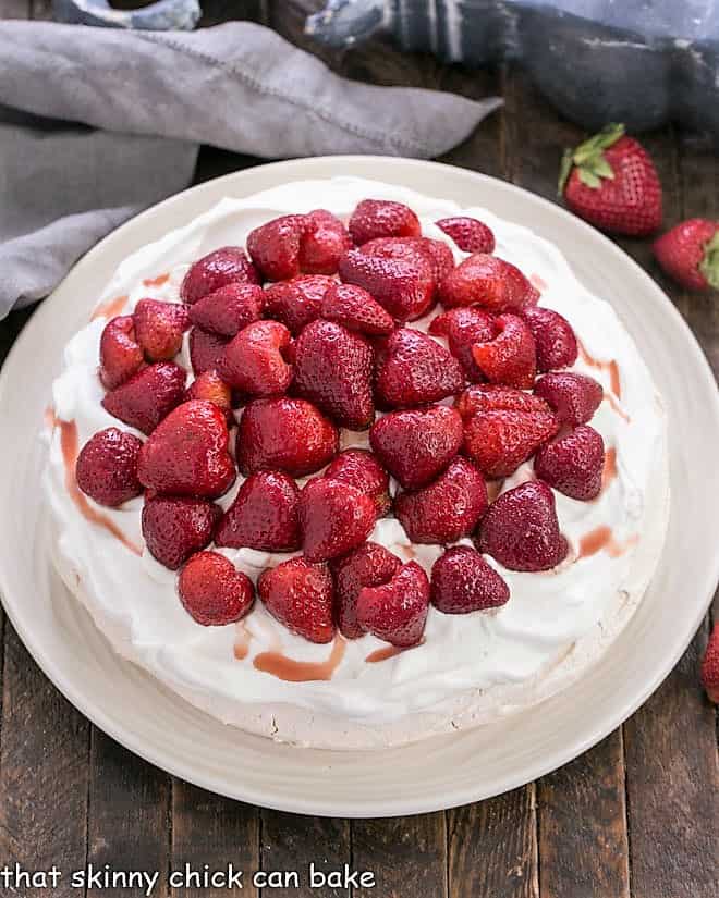 Overhead view of a Strawberry Pavlova on a white serving plate.