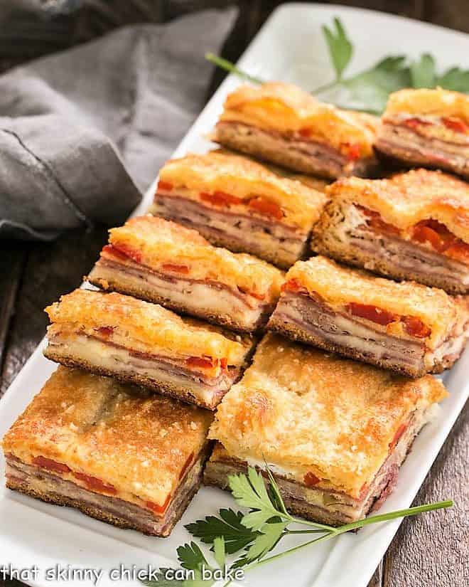 Antipasto Squares lined up on a rectangular platter