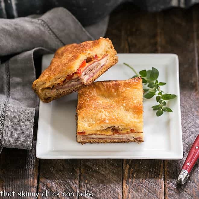 Antipasto Squares on a square white plate.