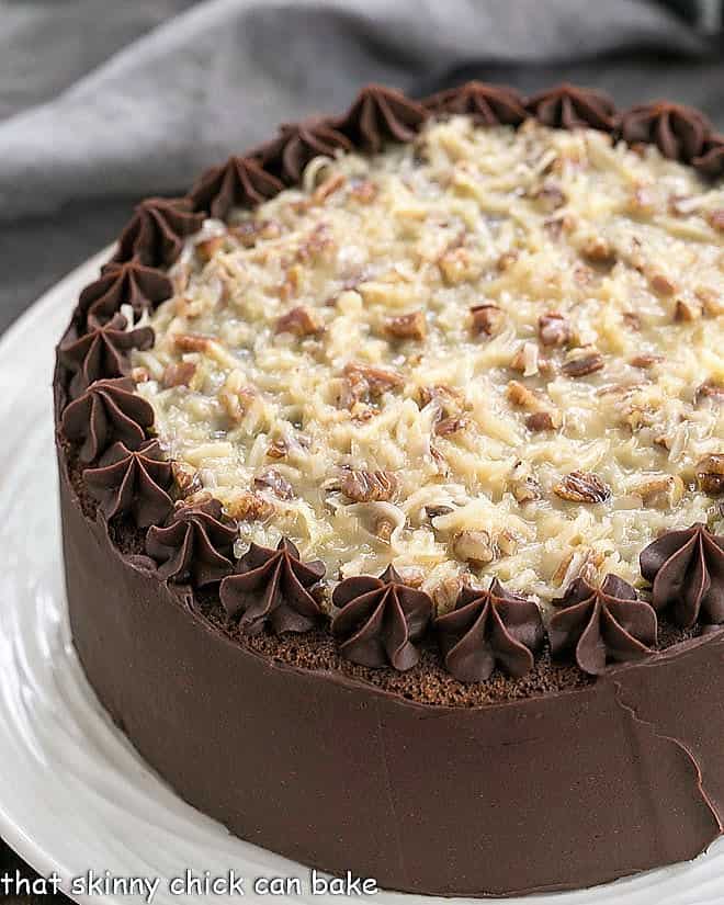 German Chocolate Cake on a white cake plate.