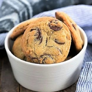Famous NYT chocolate chip cookies in a white ceramic bowl