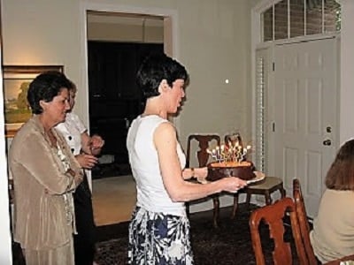 Liz carrying a German Chocolate Cake, 2009.