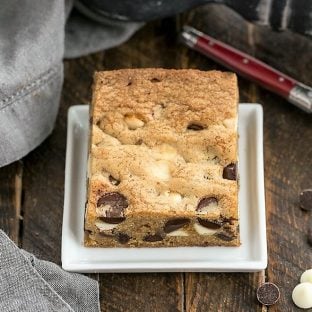 One chocolate chip cookie bars on a square white plate