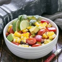 Avocado corn salad in a small serving bowl