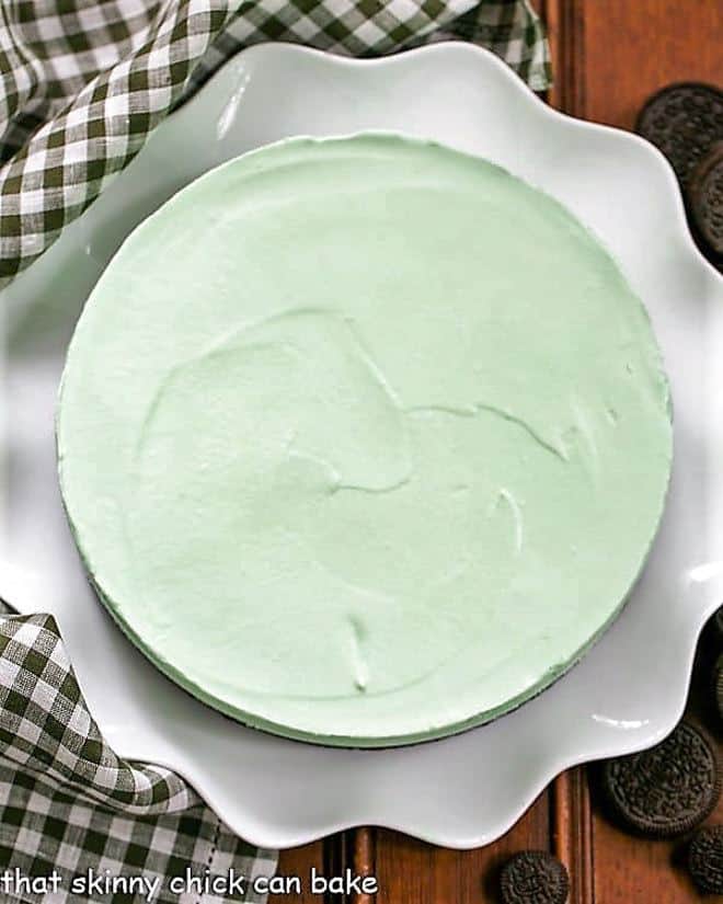 Frozen Grasshopper Pie with an Oreo Crust on a white ceramic serving platter.