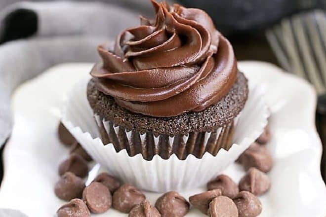 Ghirardelli Dark Chocolate Cupcakes on a square white plate with chocolate chips