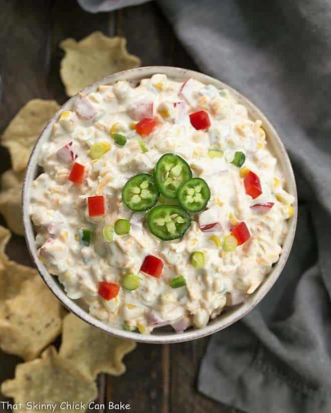 Overhead view of Sour Cream Corn Dip in a round ceramic dish.