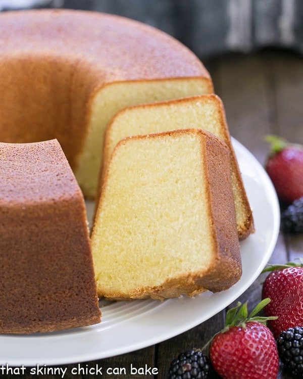 The Best Pound Cake and slices on a cake plate.