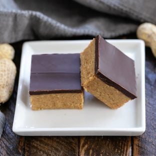 Better Than Reese's Peanut Butter Bars stacked on a small square white plate