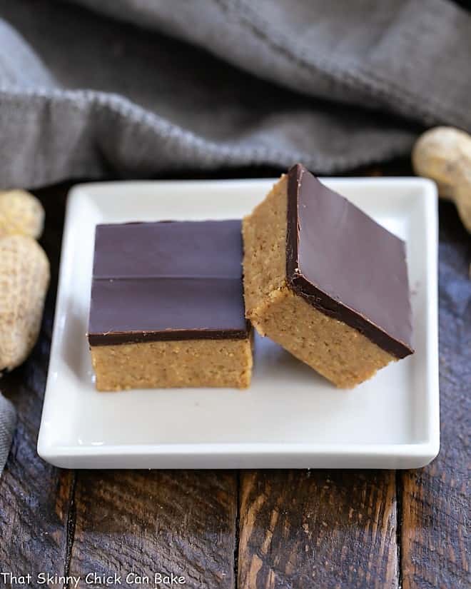 Better Than Reese's Peanut Butter Bars stacked on a small square white plate.