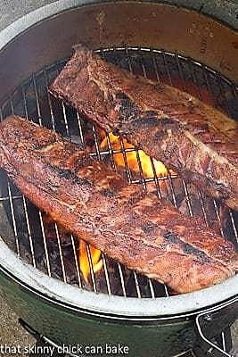 Two racks of Fall Off the Bone Baby Back Ribs on the grill.