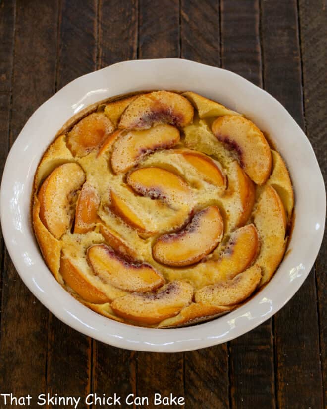 Fresh Peach Tart - A classic French dessert with a peach twist! Peach Clafoutis in a white dish.