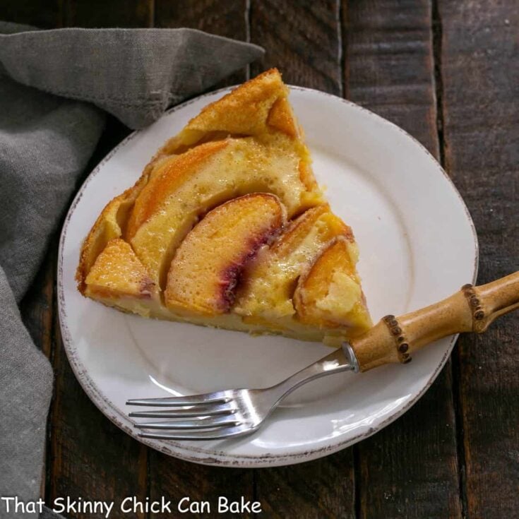 Overhead view of a lice of peach clafoutis.