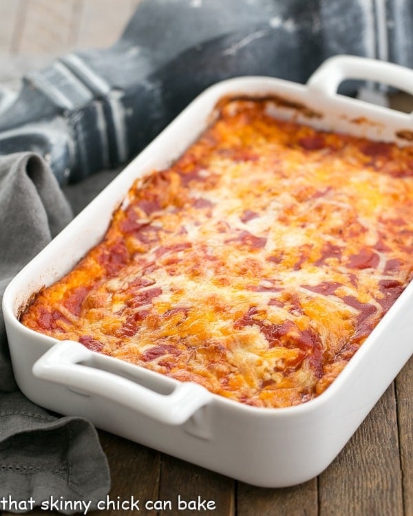 a white casserole dish with Chiles Rellenos Casserole.