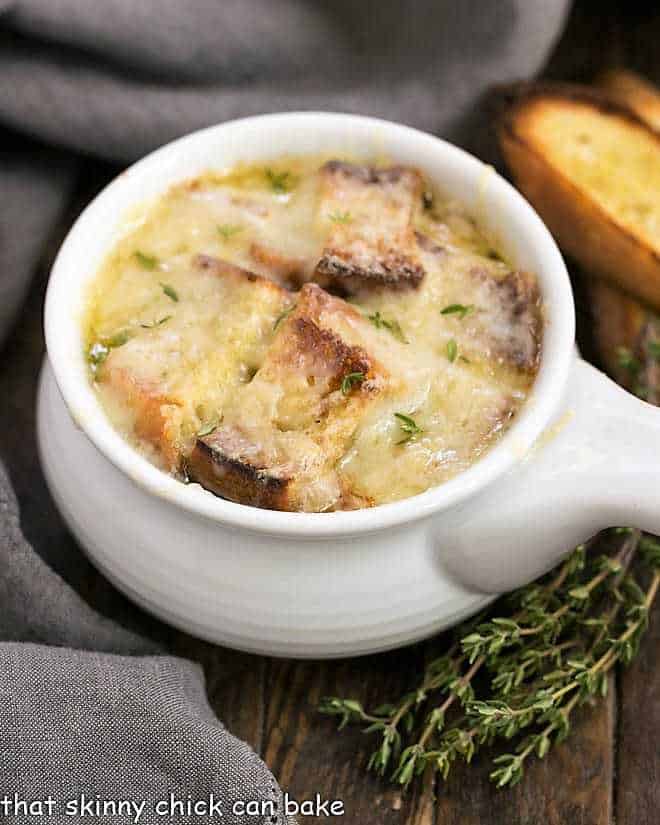 Classic French Onion Soup in a white ceramic soup bowl.