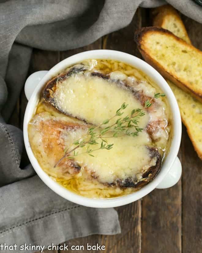 Classic French Onion Soup topped with two slices of cheesy toasts.