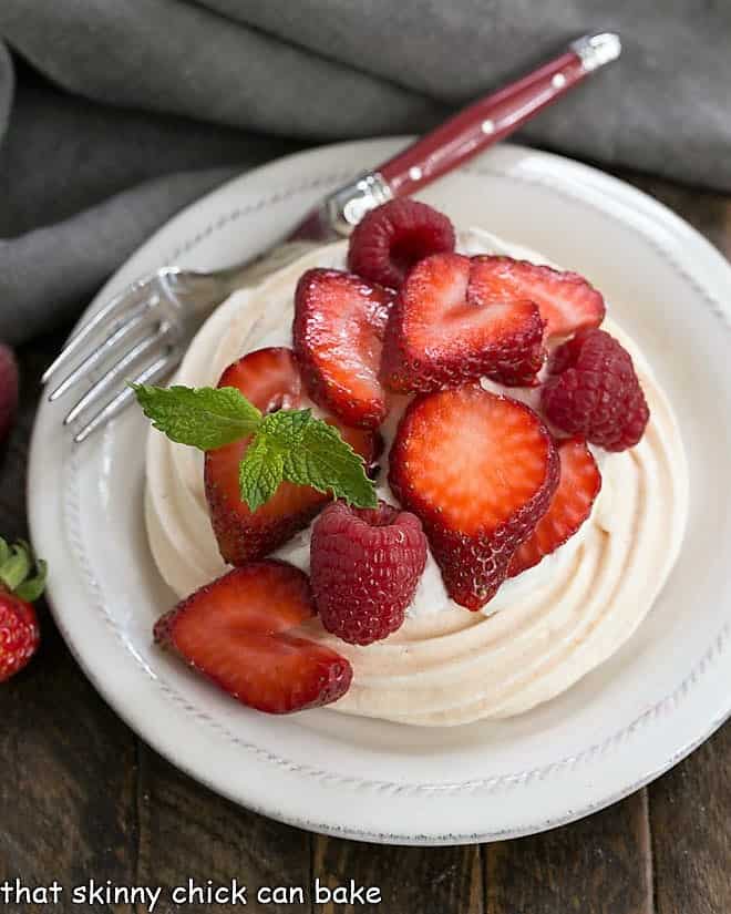 A mini pavlova on a round white plate