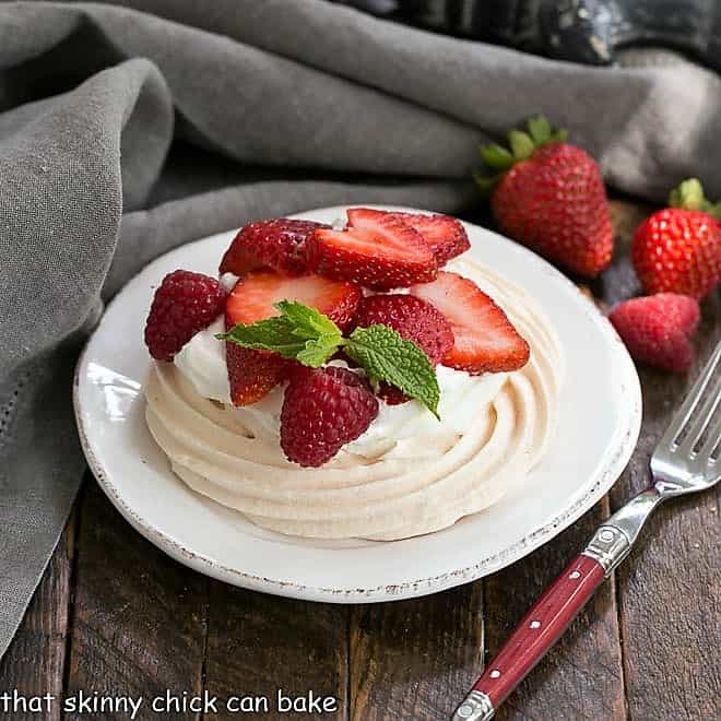 A mini pavlova on a round white plate