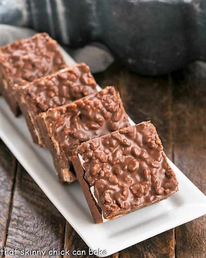 Peanut Butter Krispie Topped Brownies on a white platter