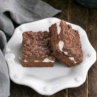 overhead view of 2 Peanut butter krispie brownies on a decorative white plate