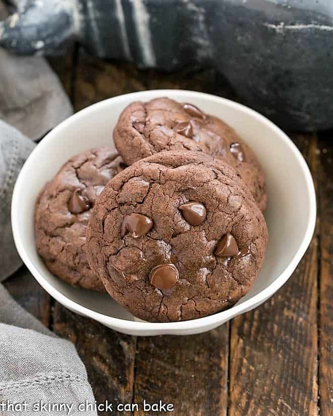 3 double chocolate cookies in a white bowl