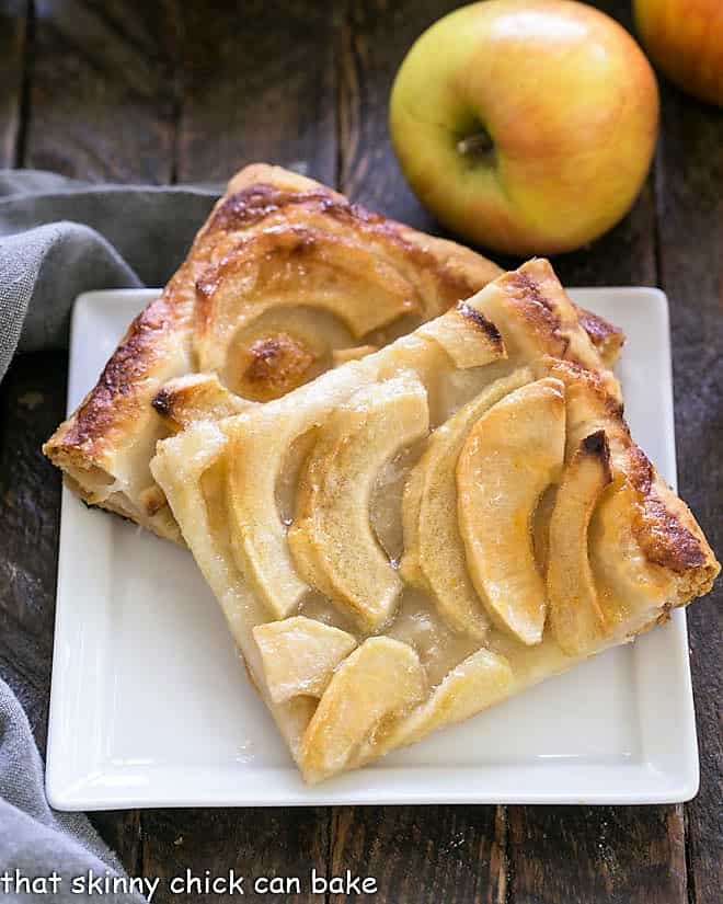 Easy, buttery French Apple Tart with Puff Pastry slices on a dessert plate