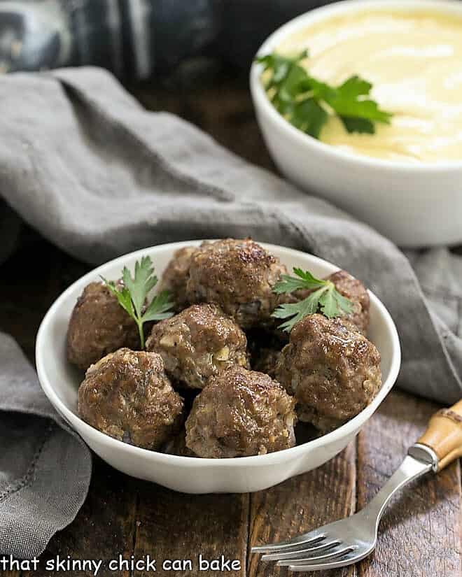 Indian Meatballs with Yogurt Sauce in white bowls