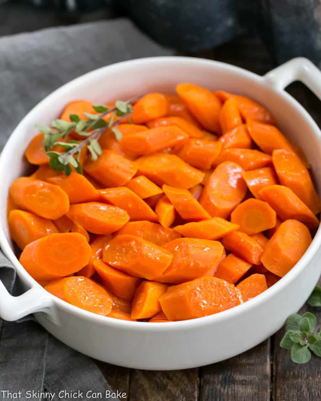 Bourbon Maple Glazed Carrots in a white ceramic dish.