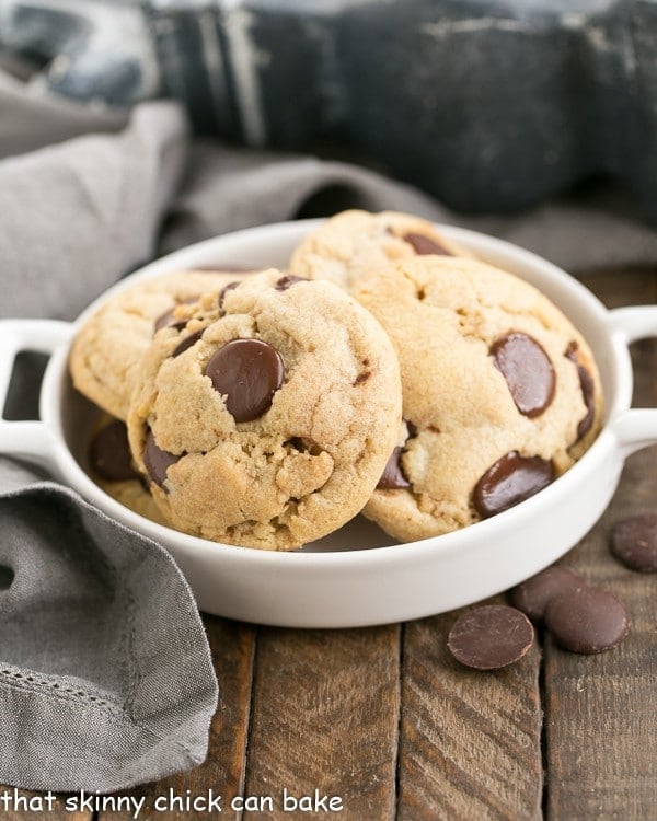 Thick and Chewy Chocolate Chip Cookies in a shallow handled dish.