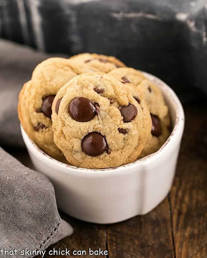 Killer chocolate chip cookies in a small white bowl