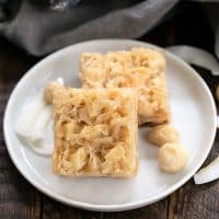 Coconut Macadamia Nut Bars on a round white ceramic plate