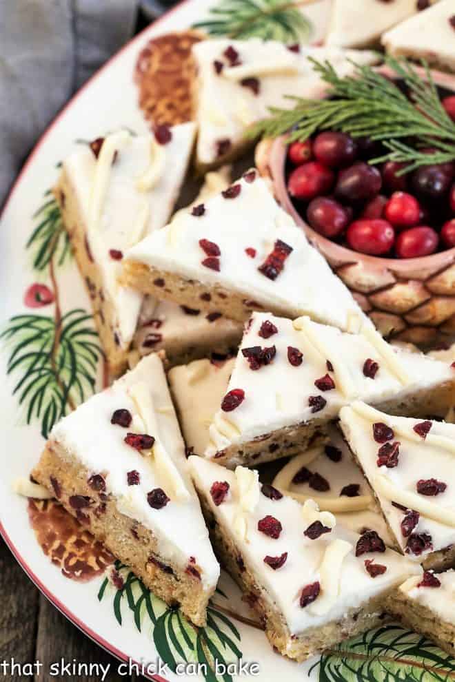 Tray of starbucks cranberry bliss bars with a bowl of fresh cranberries