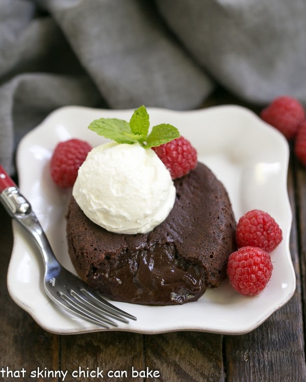 Easy Molten Lava Cake on a square plate with a scoop of vanilla ice cream
