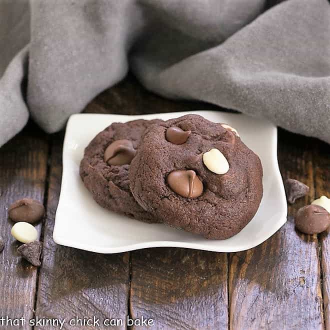 Quadruple Chocolate Cookies on a small, wavy, white plate.