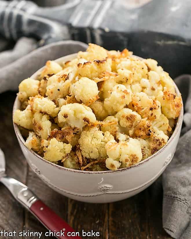 Oven Roasted Cauliflower in a white serving bowl.