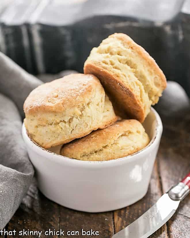 A white bowl of homemade buttermilk biscuits