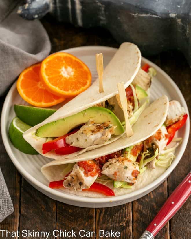 2 Grilled Fish Tacos on a white plate
