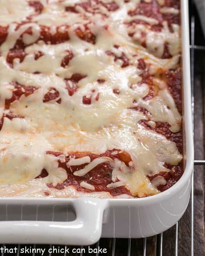 Close up of manicotti in a casserole dish