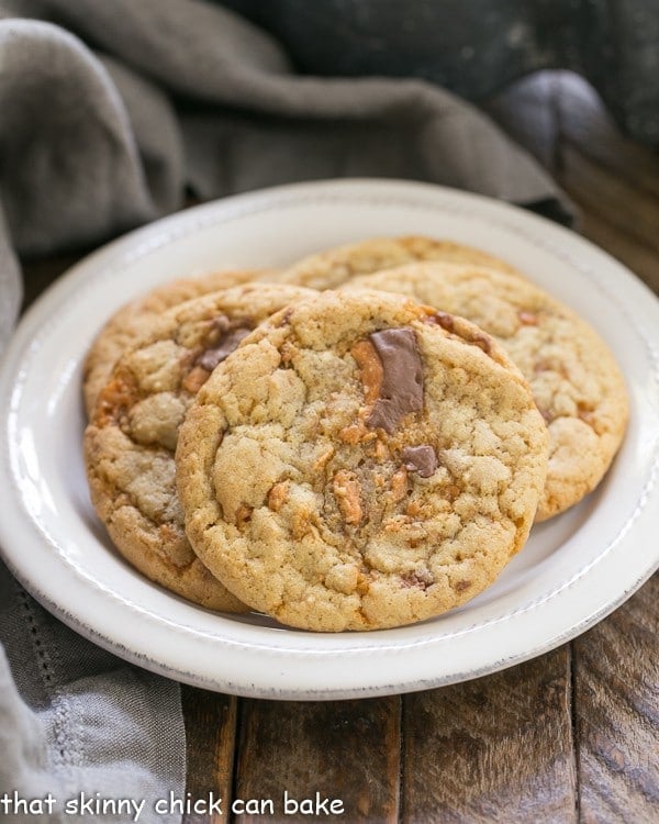 Chewy Butterfinger Cookies arranged on a round white plate.