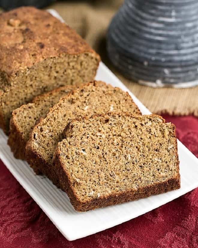 Easy Irish Brown Bread loaf and slices on a white tray.