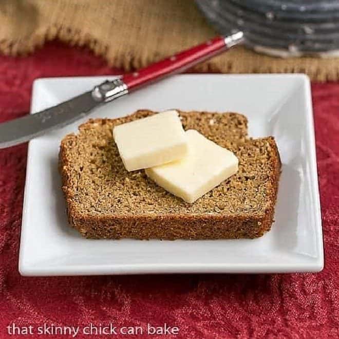 Easy Irish Brown Bread slice topped with butter on a square white plate