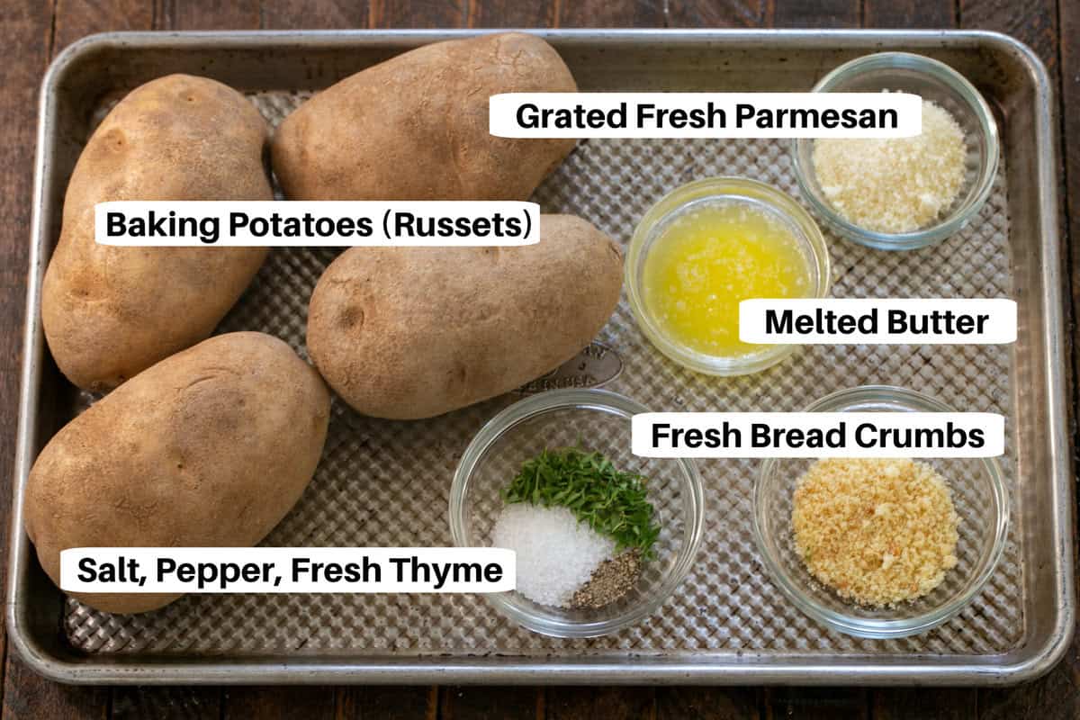 hasselback potatoes ingredients with labels on a sheetpan.