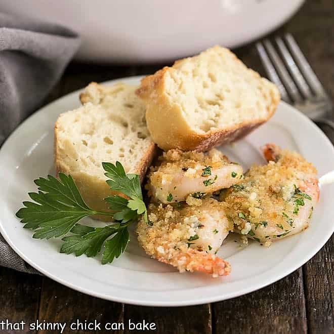 Baked Garlic Shrimp with bread on a small white plate