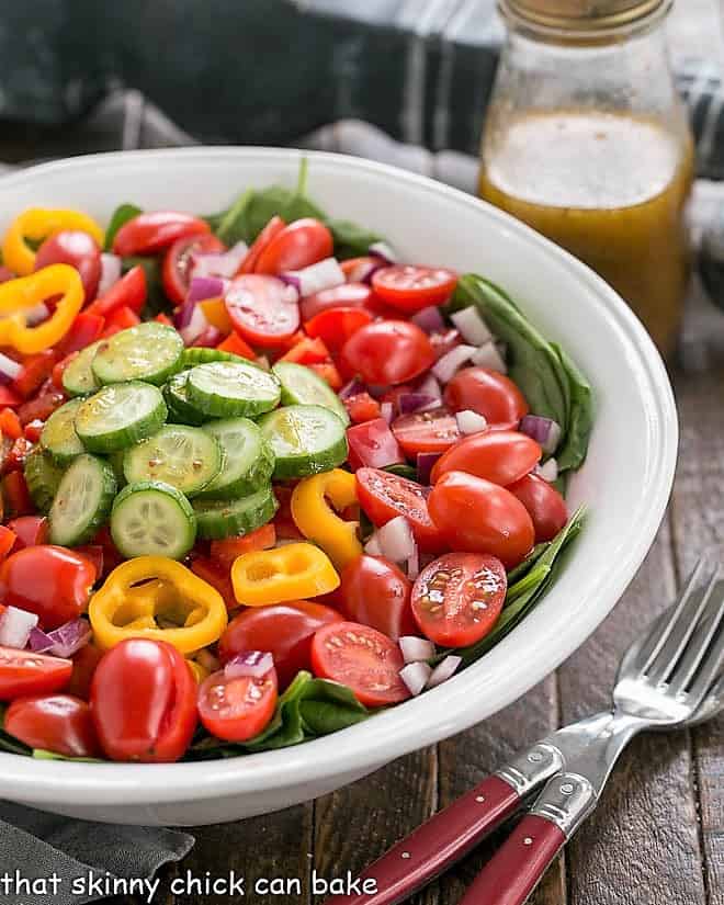 Gazpach Spinach Salad dressed with a red wine vinaigrette.