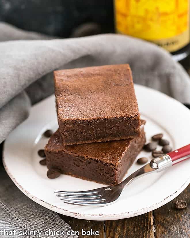 Kahlua brownies on a white plate with a red handled fork